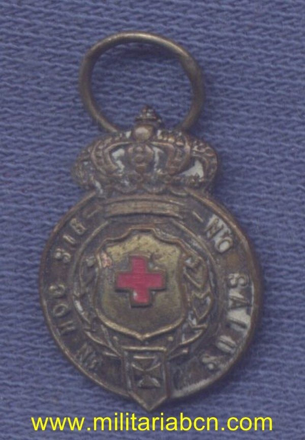 Militaria Barcelona España. Epoca Alfonso XIII. Miniatura. Medalla de 3ª Clase de la Cruz Roja Española. Con anilla, sin cinta.