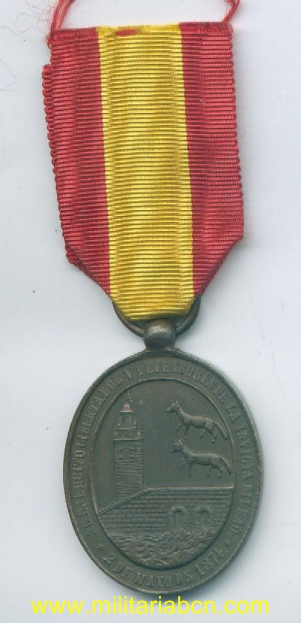España. Medalla a los Defensores de Bilbao. 1874. tercera Guerra Carlista. 34 x 42 mm. Concedida a las tropas isabelinas o liberales.