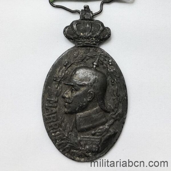 Medalla Militar de Marruecos. Con pasador Larache. 1916. Versión bronce. Versión con doble escudo en el reverso.