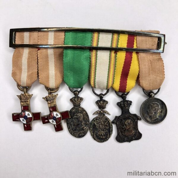 Pasador con 6 miniaturas de Medallas de la época de Alfonso XIII: